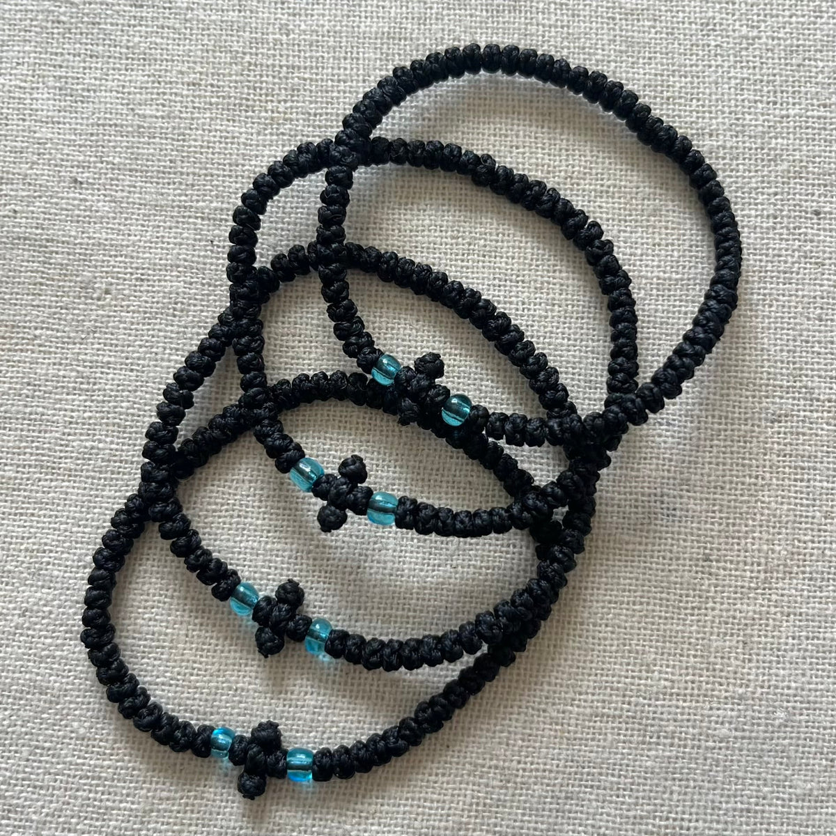 Black Komboskini bracelet for mindfulness and protection. It’s been handmade in Greece the traditional way