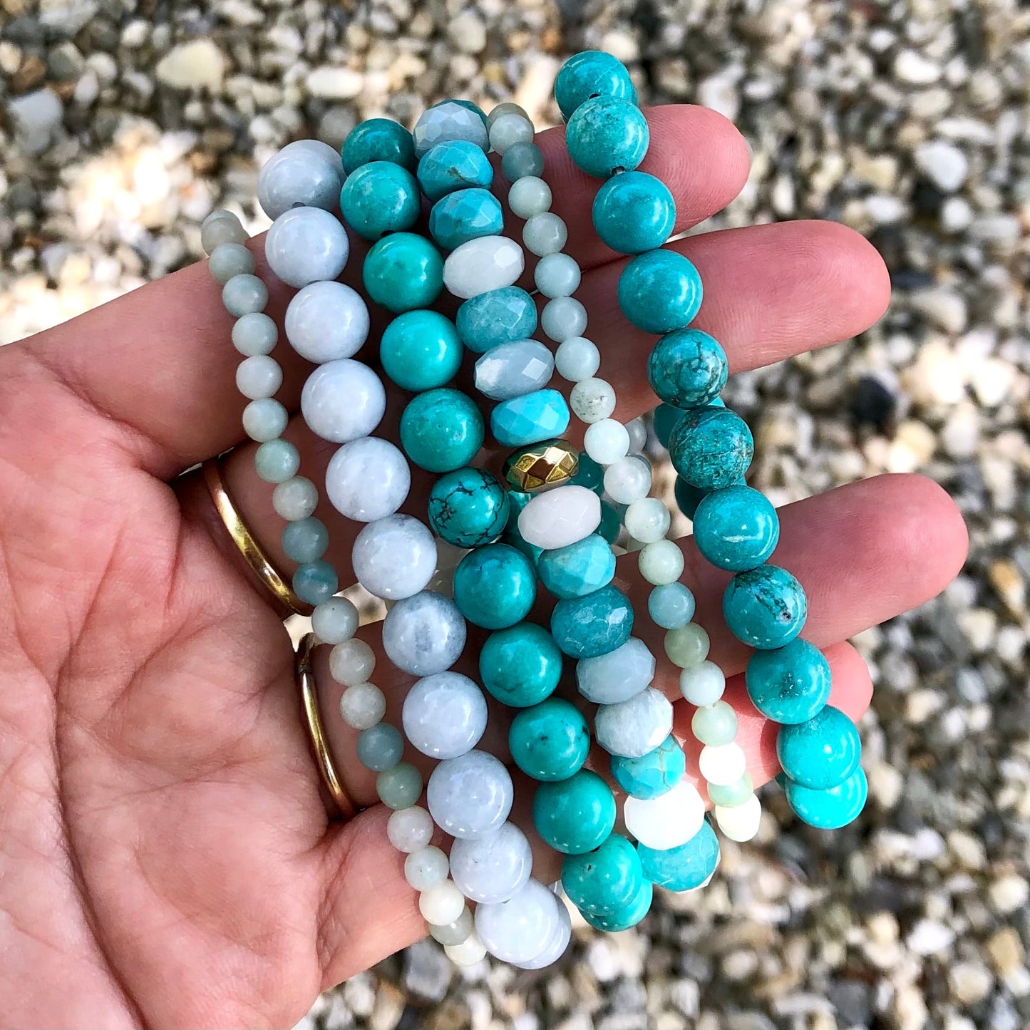 Amazonite Bracelet alongside other blue gemstone bracelets - Lithos Crystals